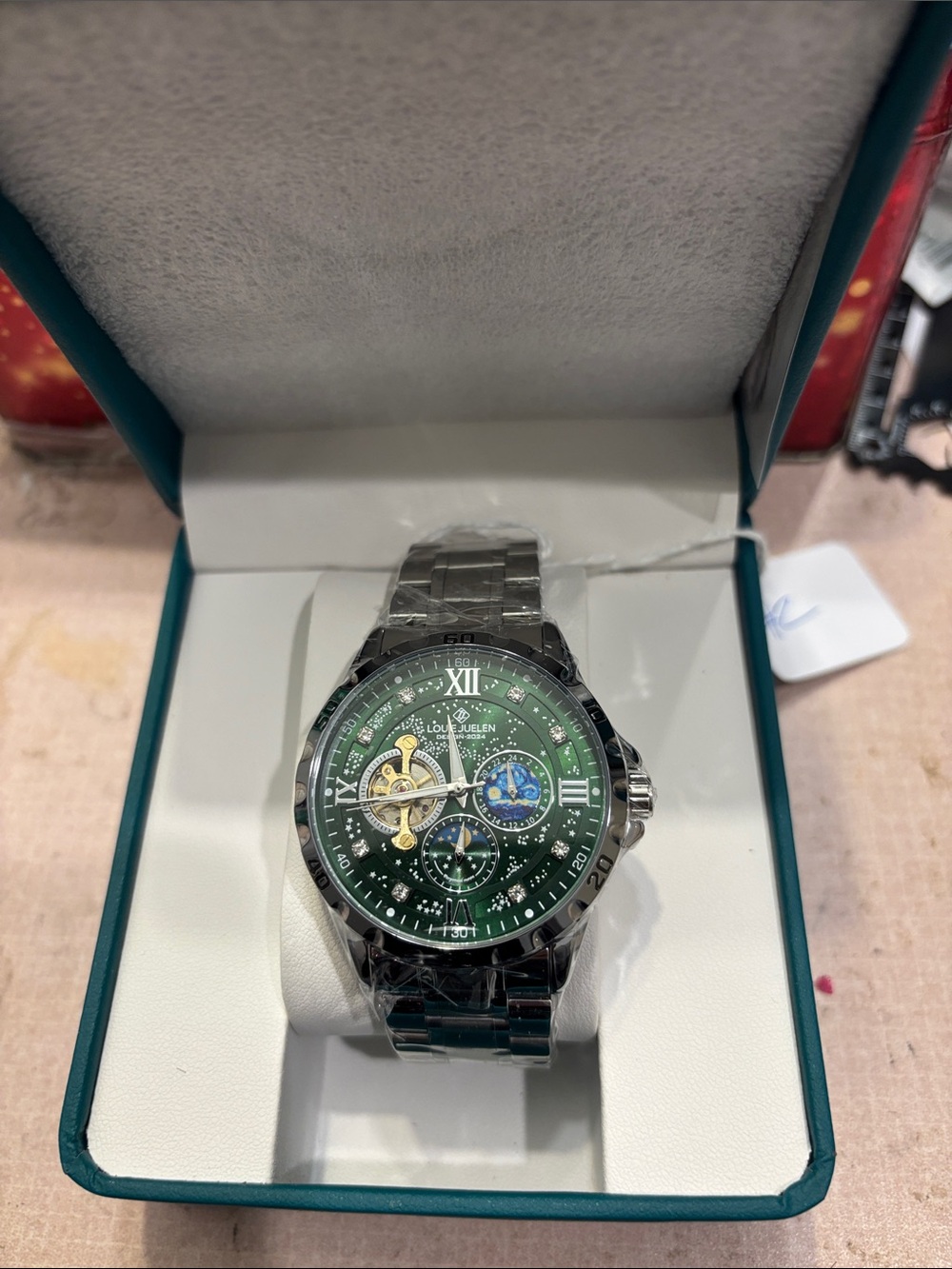Stainless Steel Men’s Watch with Green Dial and Skeleton Accent